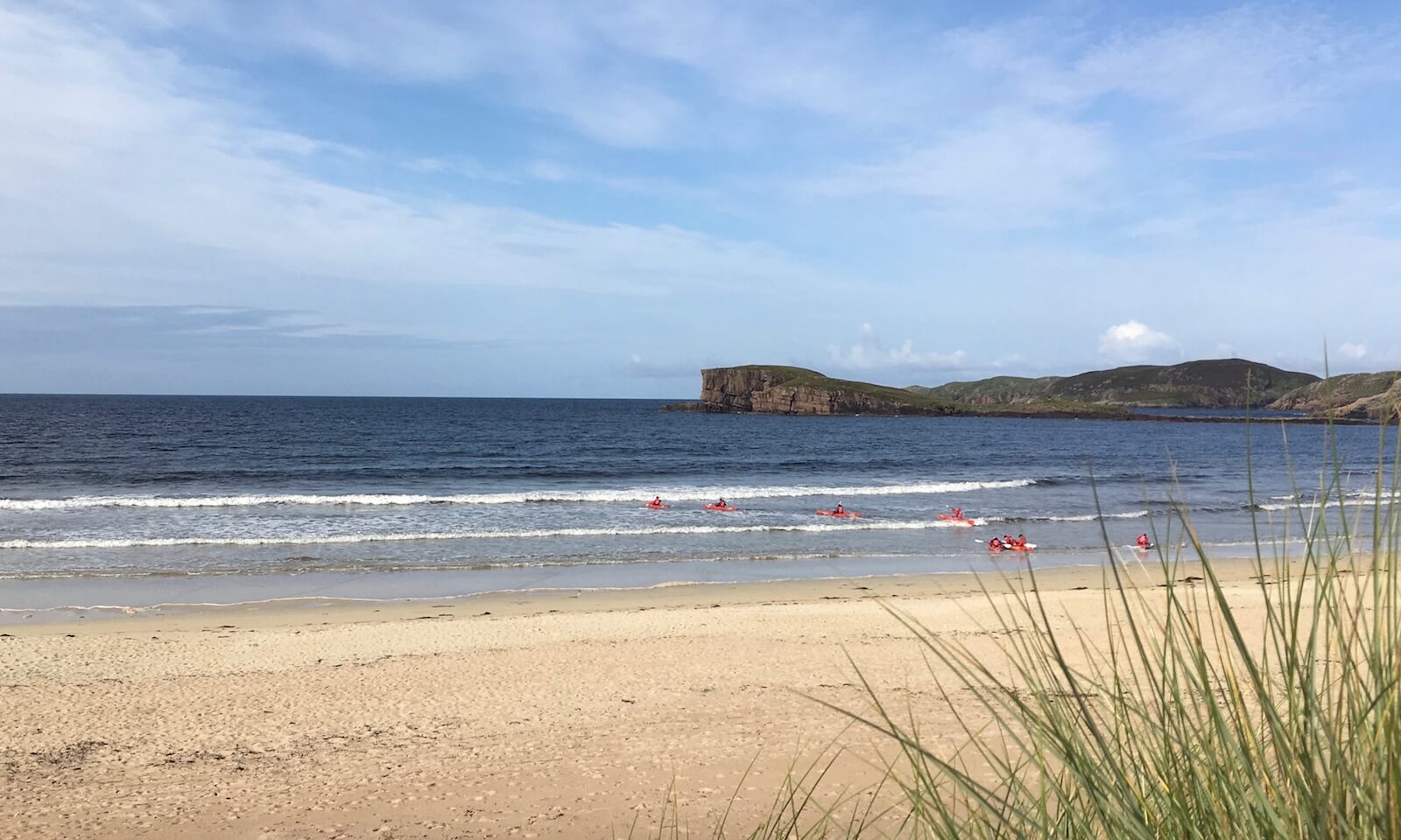 Launching sea kayaks through the surf at Oldshoremore