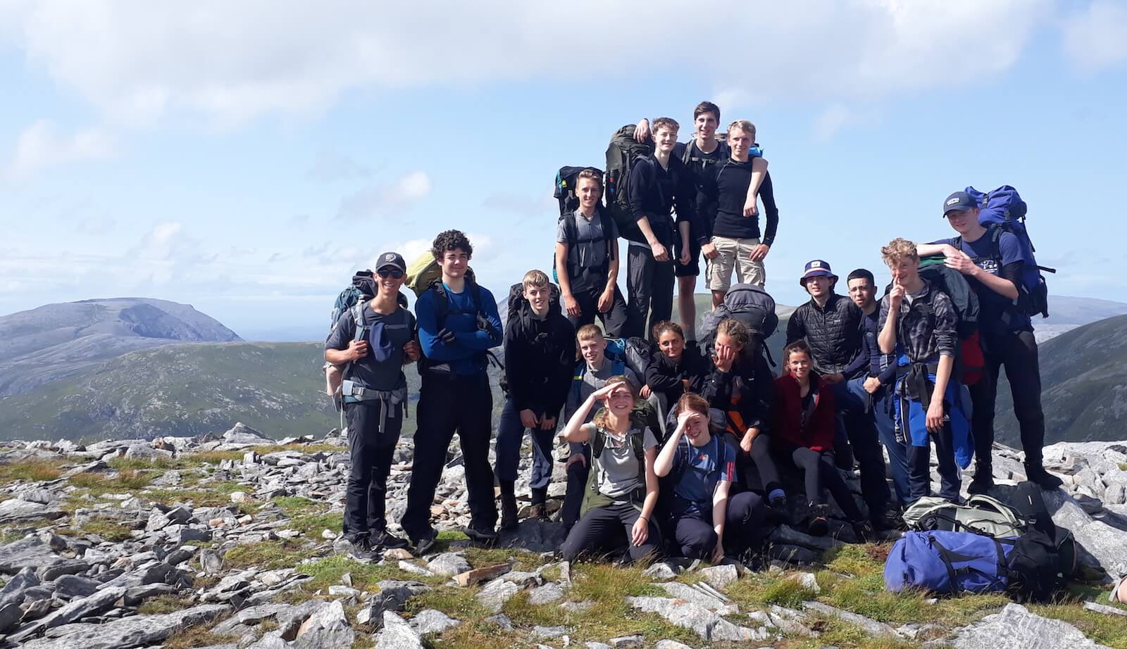 Young people in the mountains on summer camp