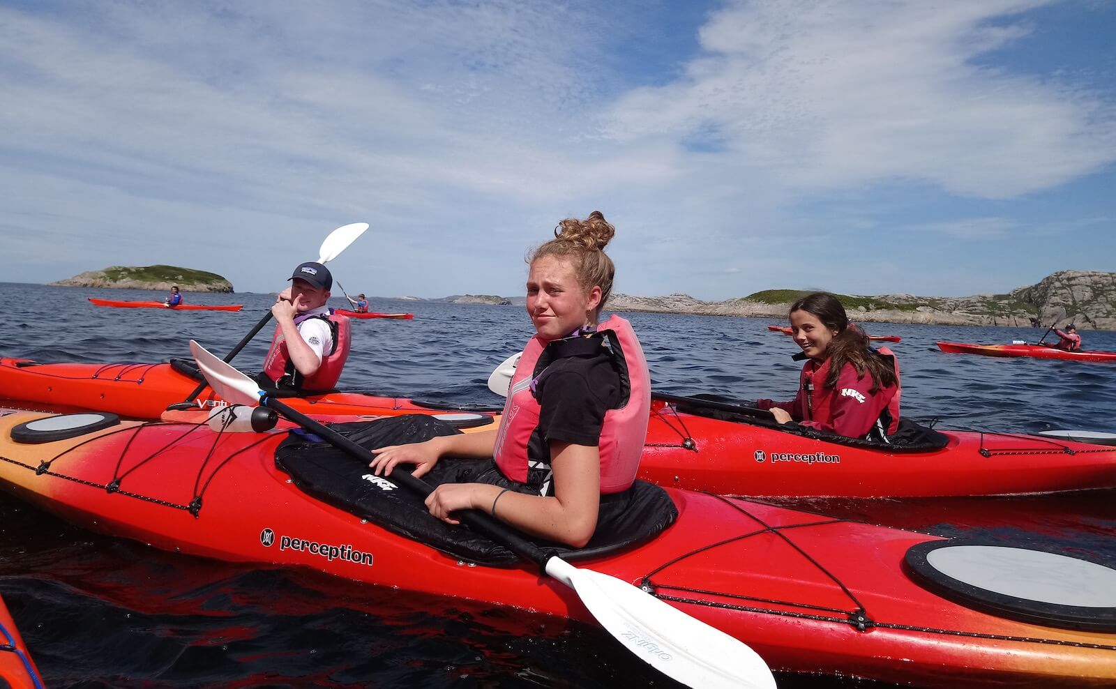 Girls sea kayaking on summer camp