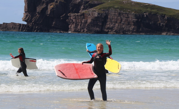 Summer camp surfing on a beach
