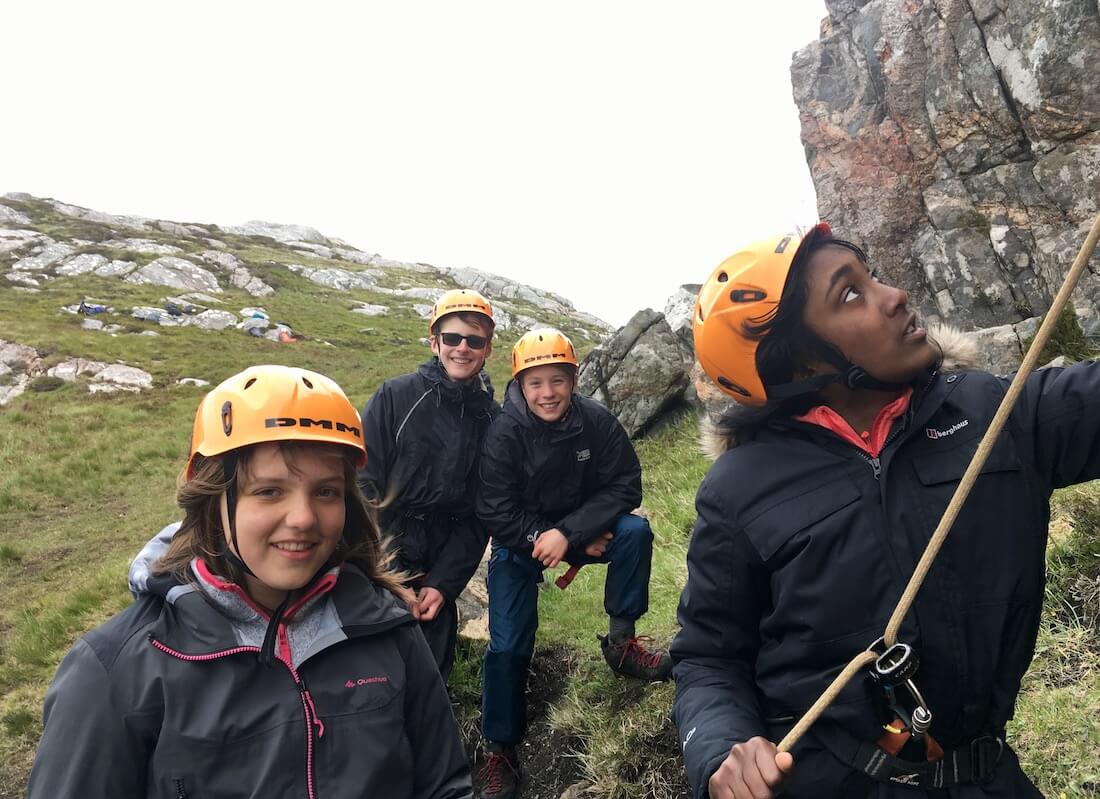 School pupils rock climbing