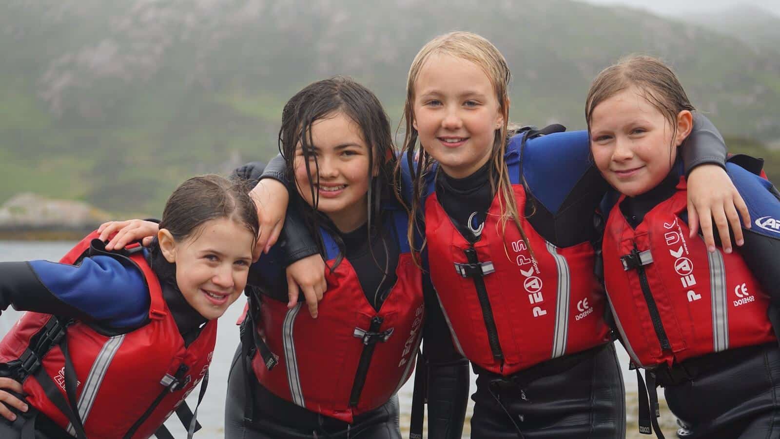 Girls on the shore after swimming at Ridgway Adventure
