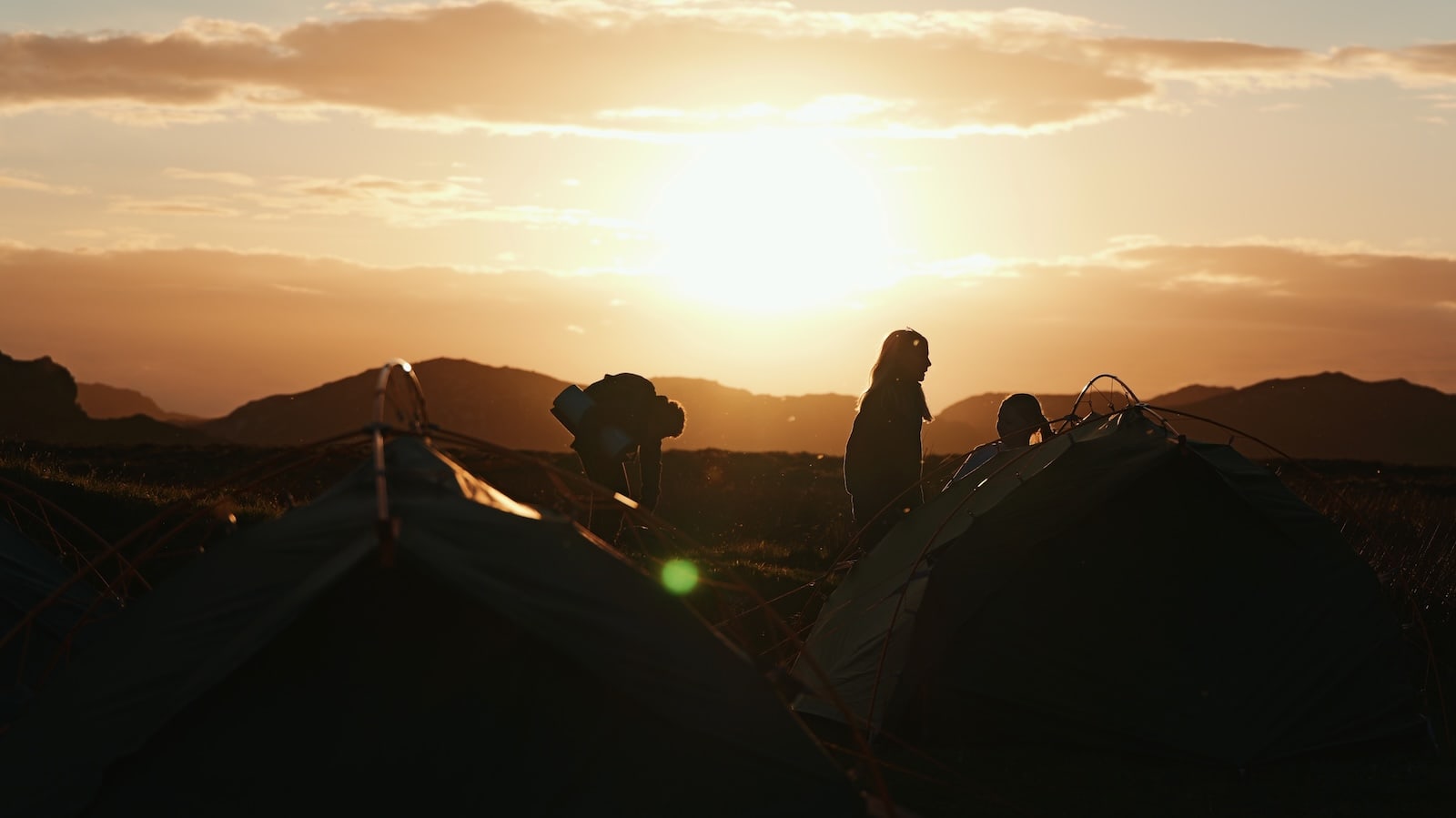 Scottish sunset with tents and children