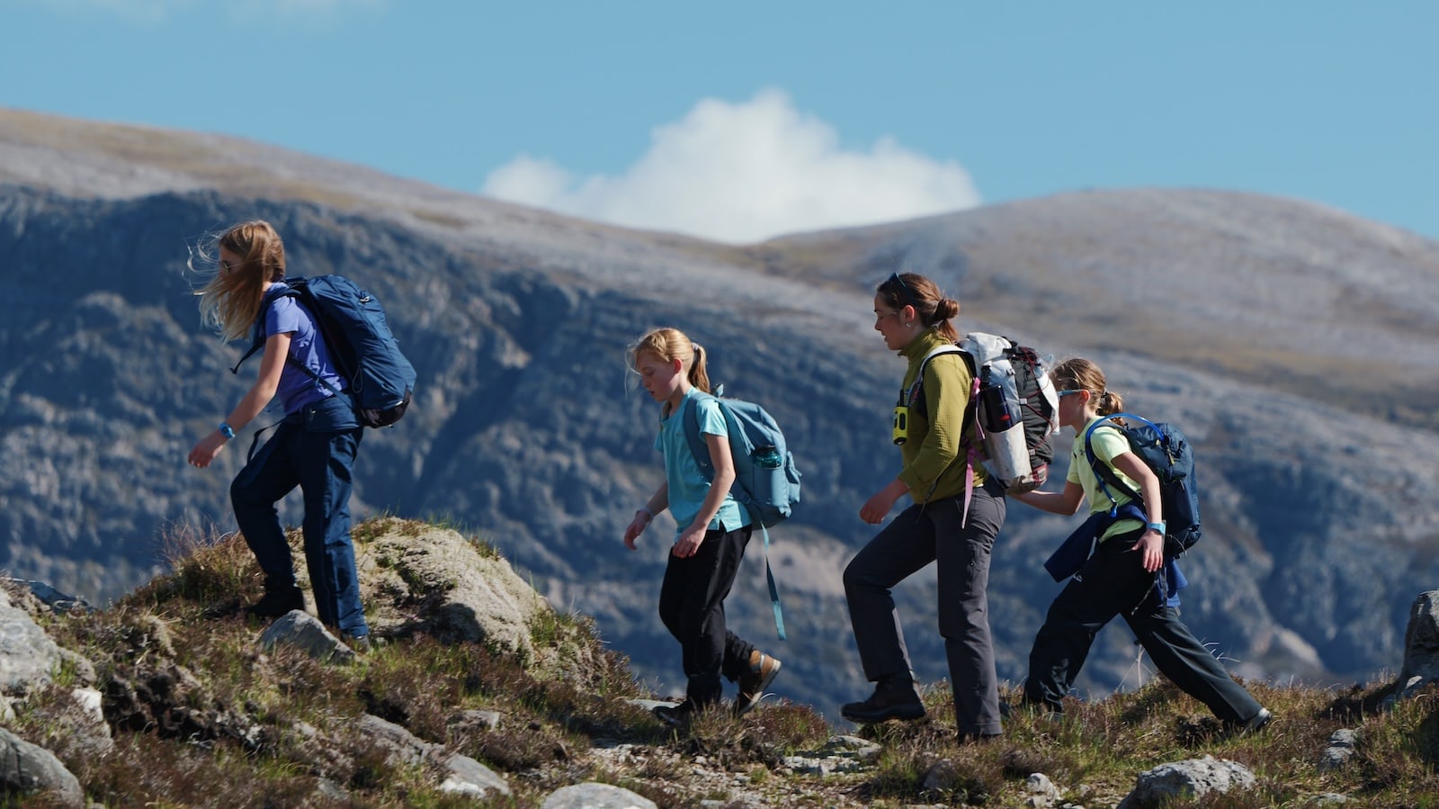 Children climbing a mountain